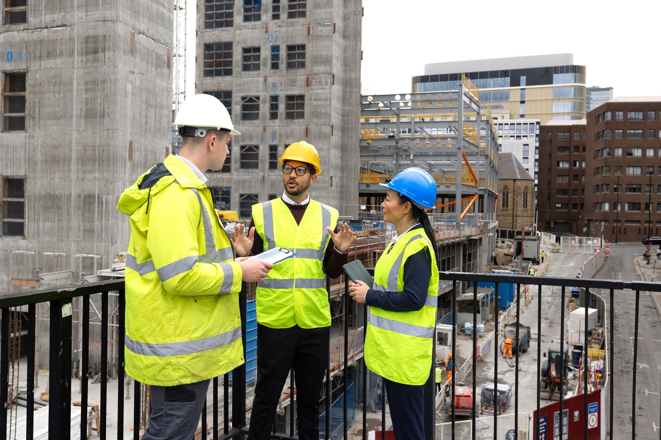Construction team reviewing plans and project data on site