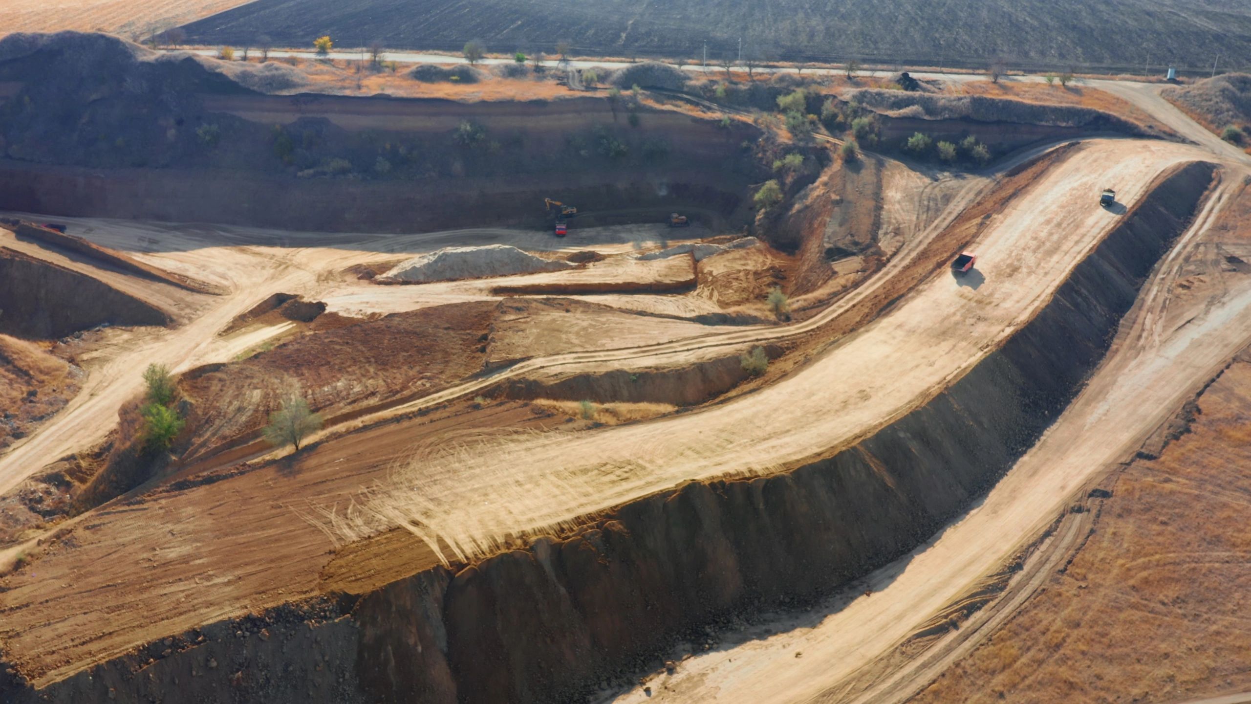 Aerial view of heavy machinery and site activity for construction insights
